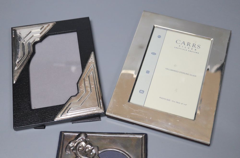 Three assorted modern mounted photograph frames including two silver, largest 20.2cm.